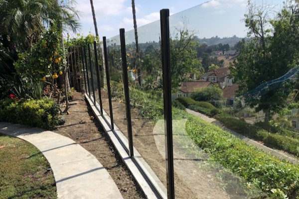 A glass fence overlooking a hilly residential area in Anaheim, California