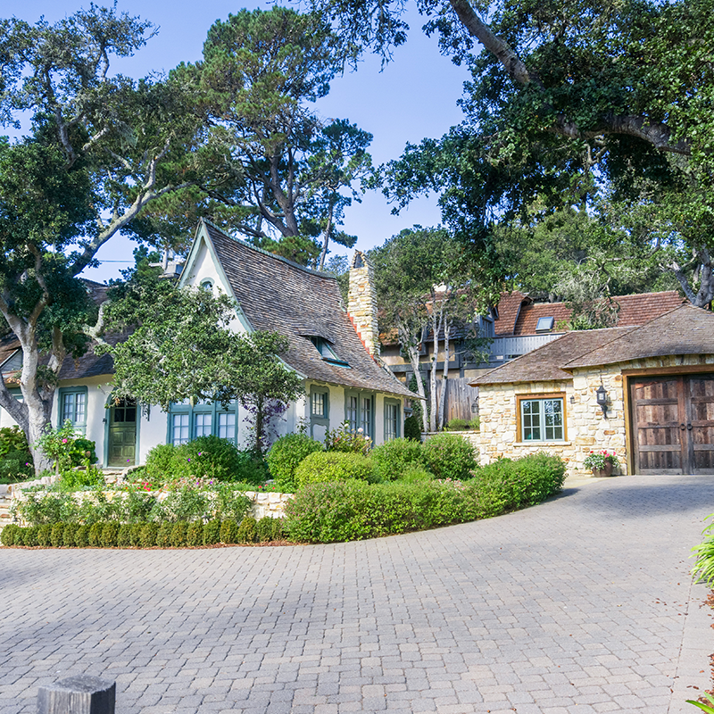 expansive english style home with large driveway